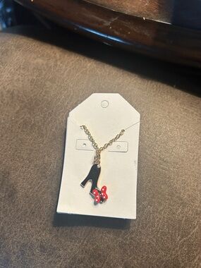 Gold-Tone High Heel Pendant Necklace with Black Shoe and Red Bow Accent